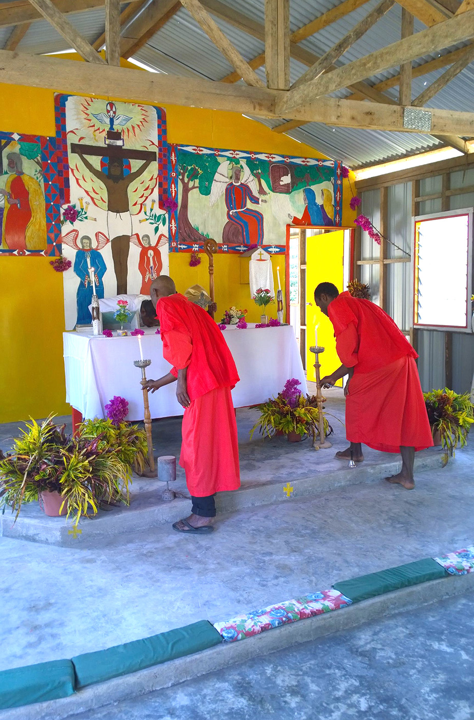 Lighting the candles at St Laurence Church, Mosa, Diocese of New Guinea Islands”. © ABM.