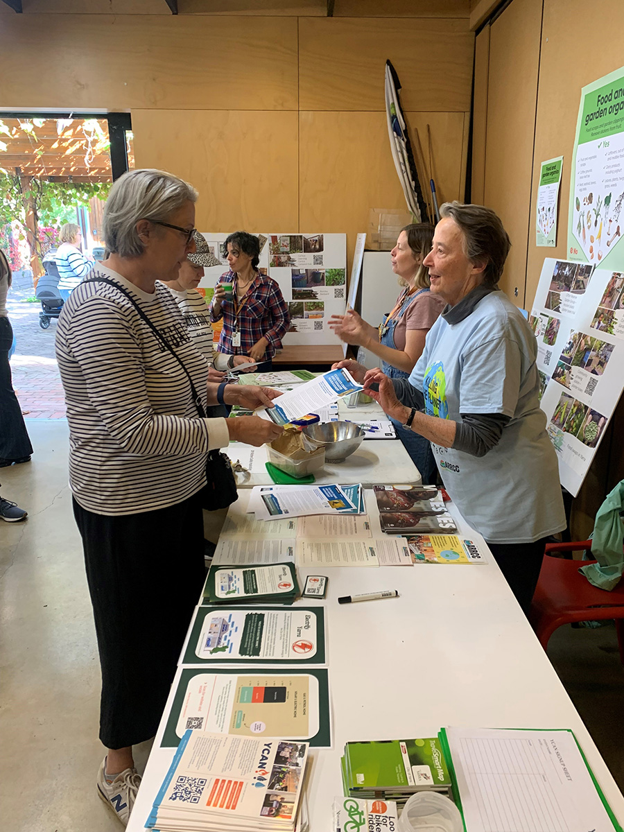 Kathy (front, right) talking about ABM AID climate change projects in the Pacific. © Kathy Kozlowski. Used with permission.