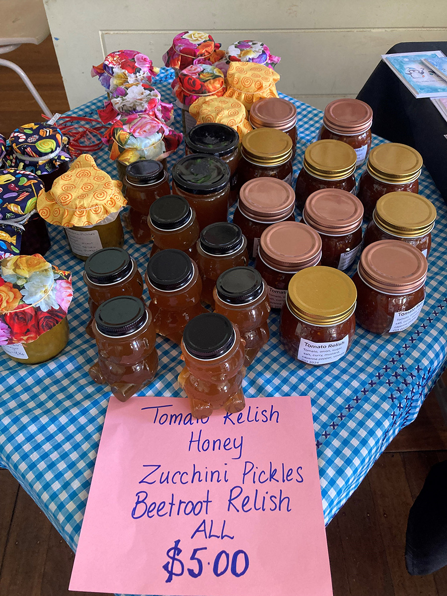 Telarah Rutherford selling jams, honey and preserves at their ABM Mission Morning Tea. © Meagan Schwarz, ABM.