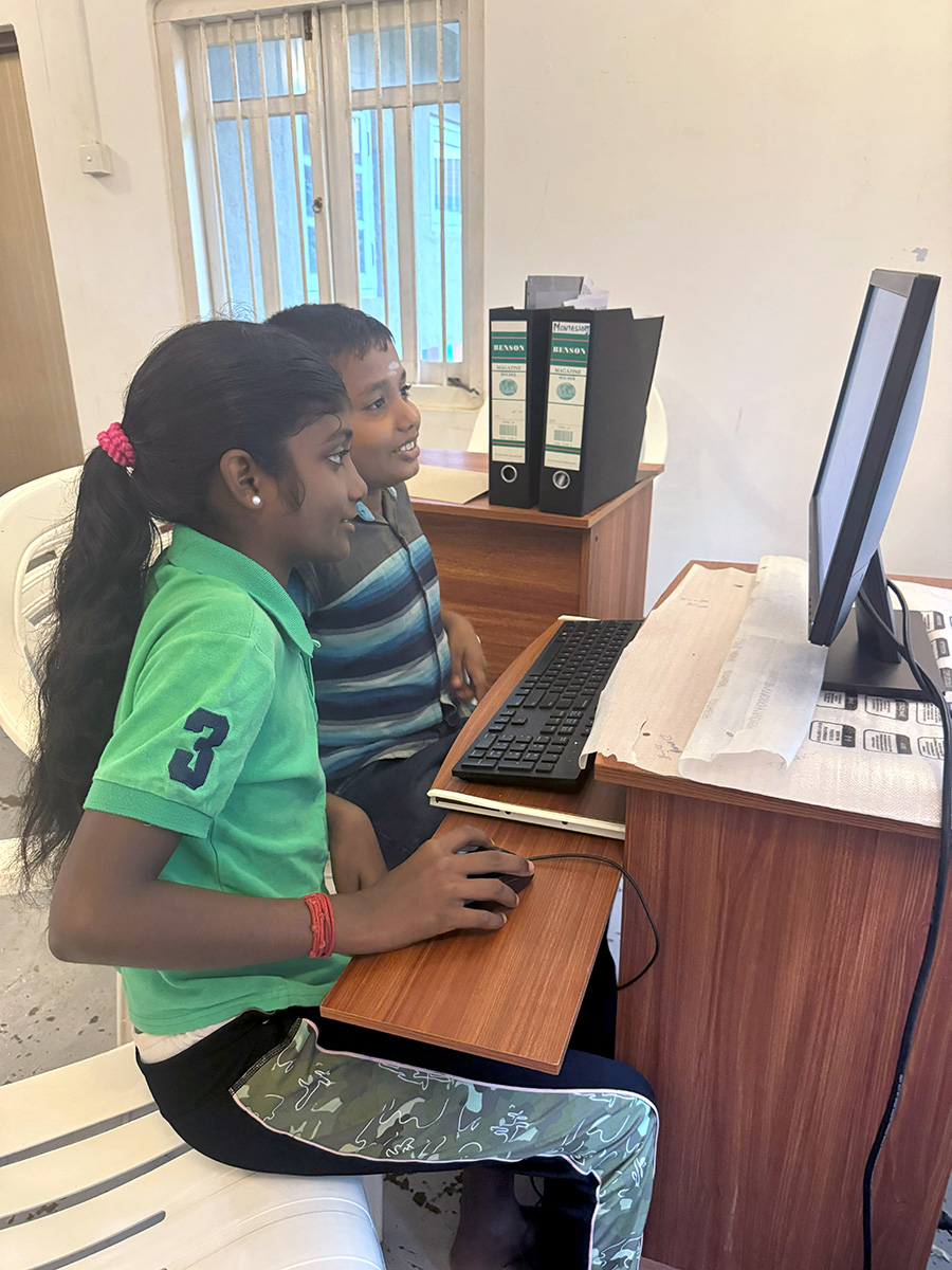 Two children at a computer at Oppuravillam Centre, Sri Lanka. © Diocese of Colombo. Used with permission.