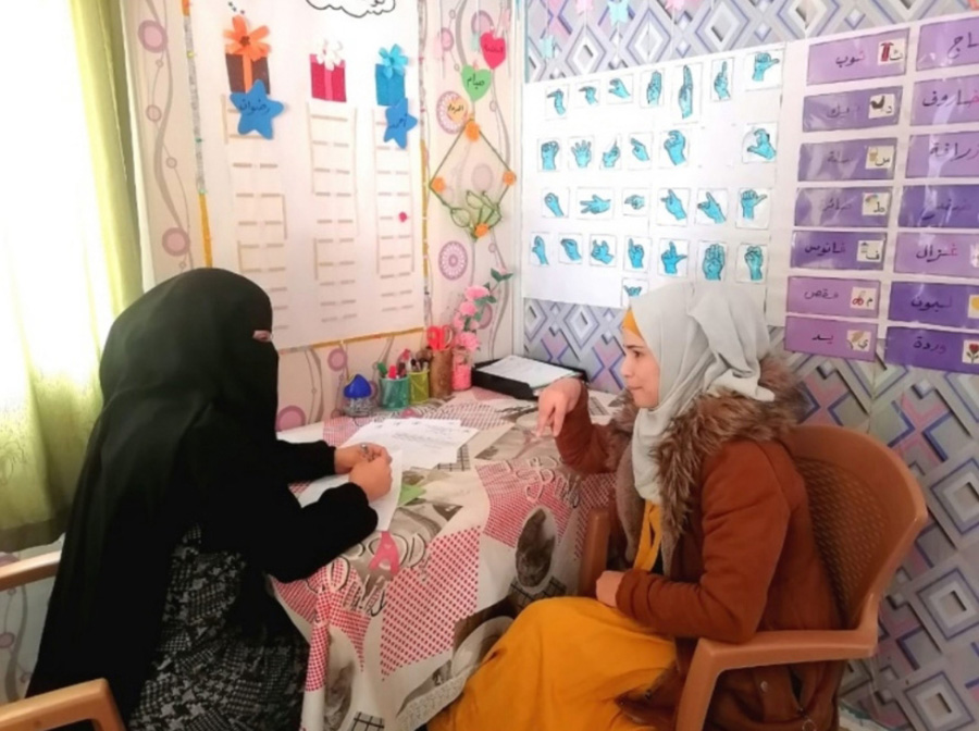 Anfal’s hearing is assessed by the Holy Land Institute for the Deaf. © Holy Land Institute for the Deaf. Used with permission.