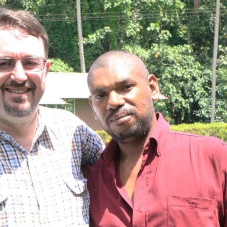 Fr Leki Kambari with ABM’s Robert McLean before his graduation © Nick Mkaronda